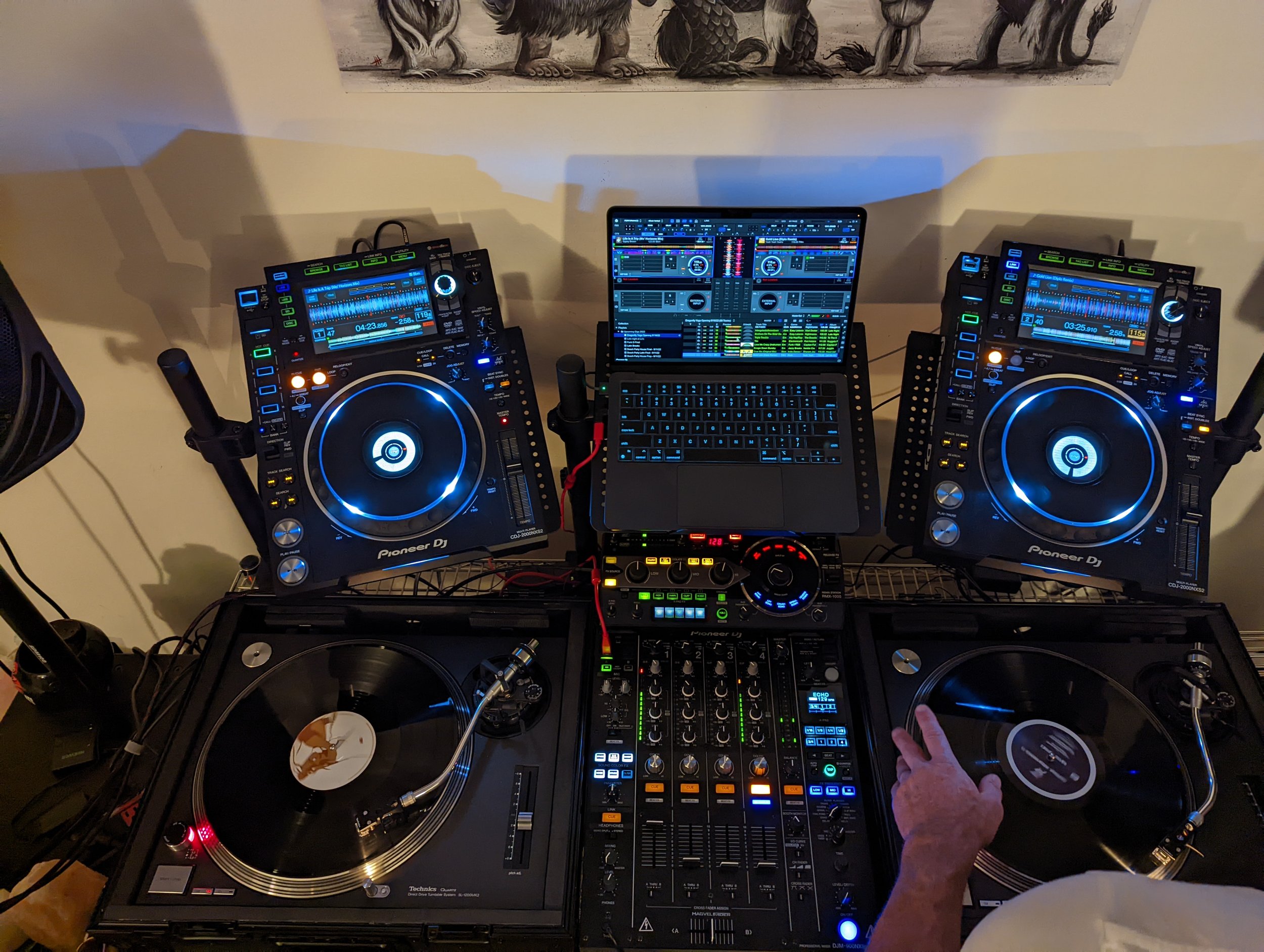 DJ booth with full Pioneer CDJ setup and mixer in a club environment