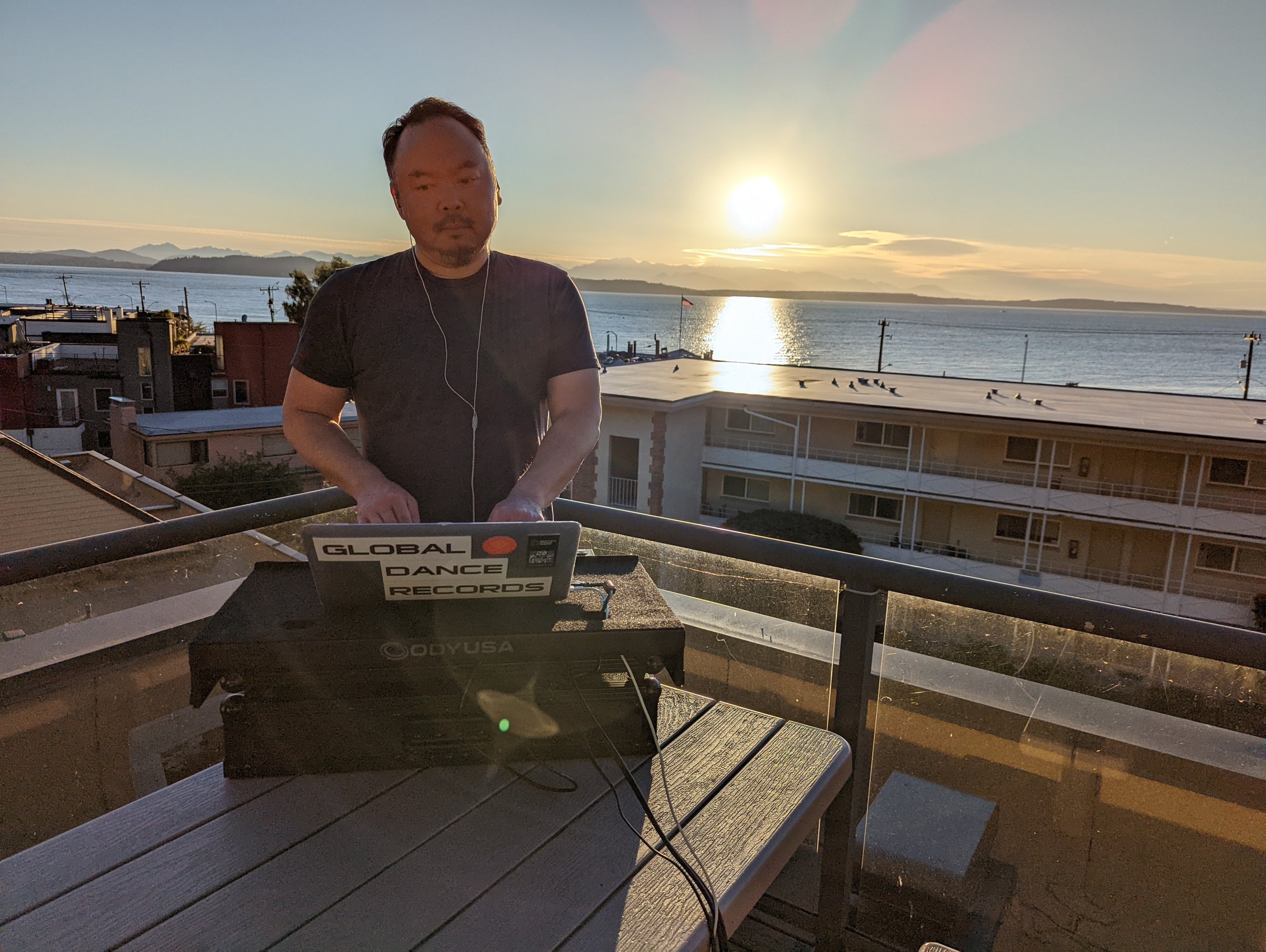 DJ performing with Pioneer CDJ setup with glowing blue jog wheels