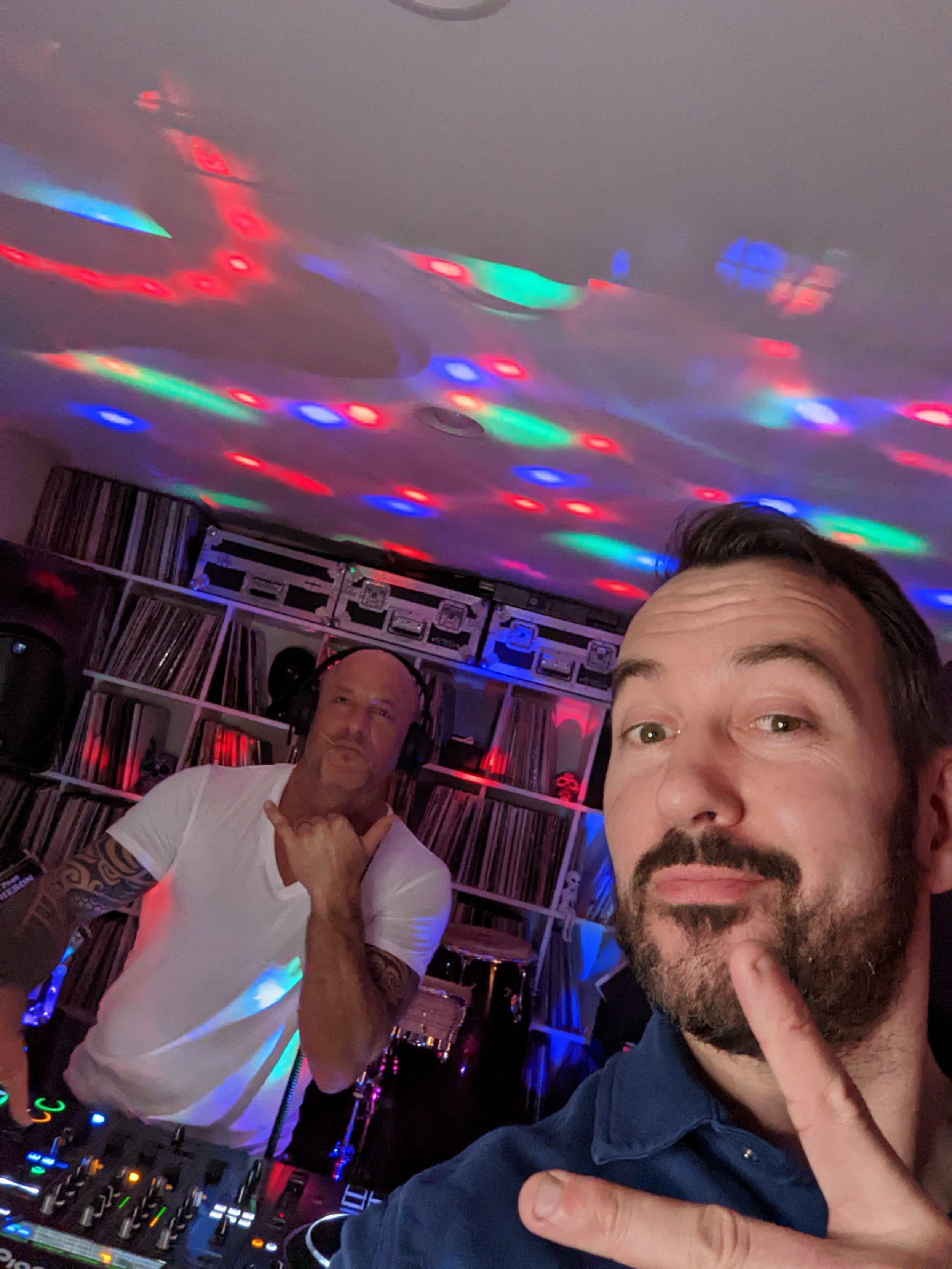 Seattle House Mafia trio dressed casually posing outdoors with city view