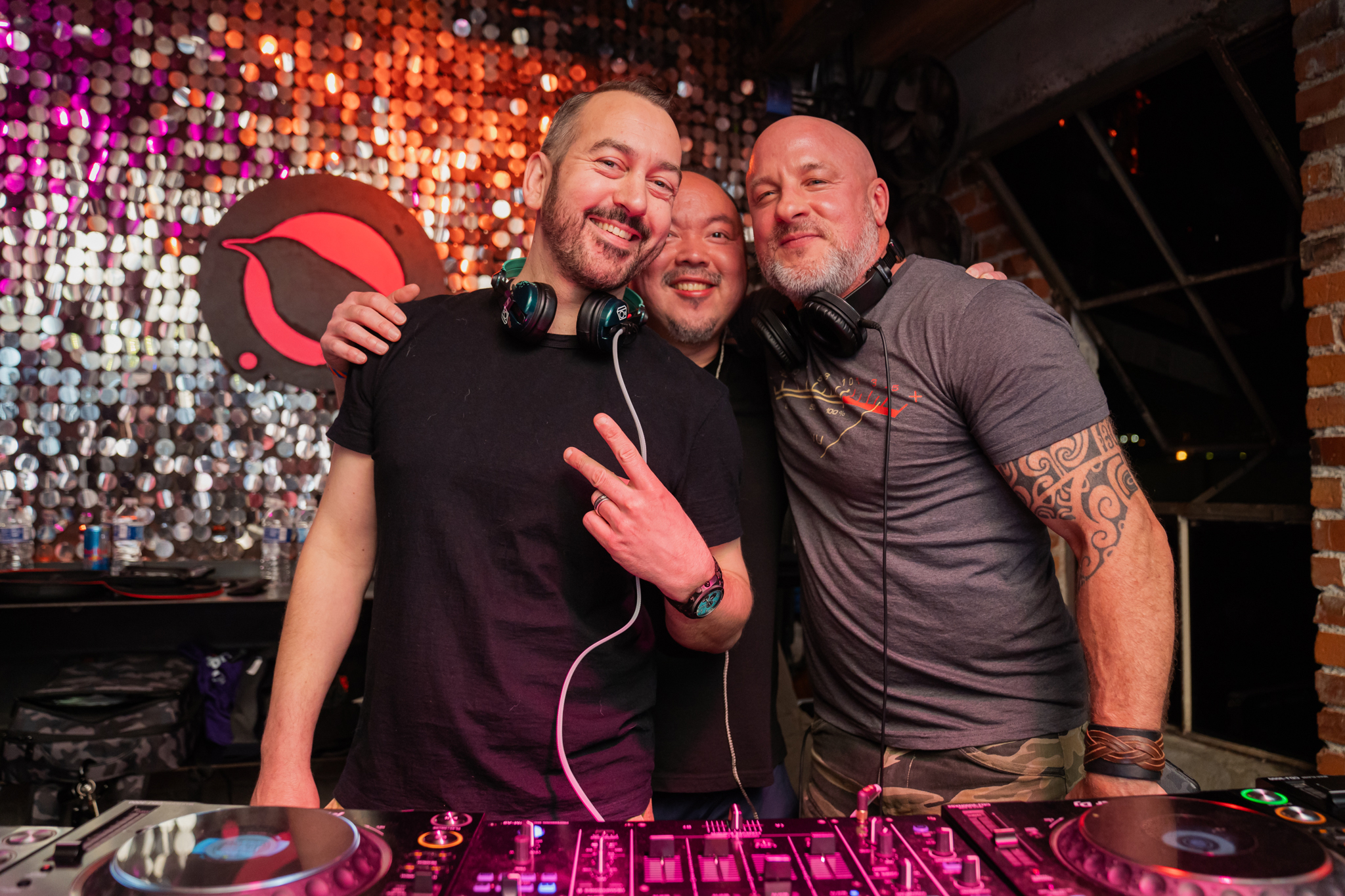 Paul Velocity, DJ Sang-Do and Phil Anthony behind the DJ turntables at Monkeyloft