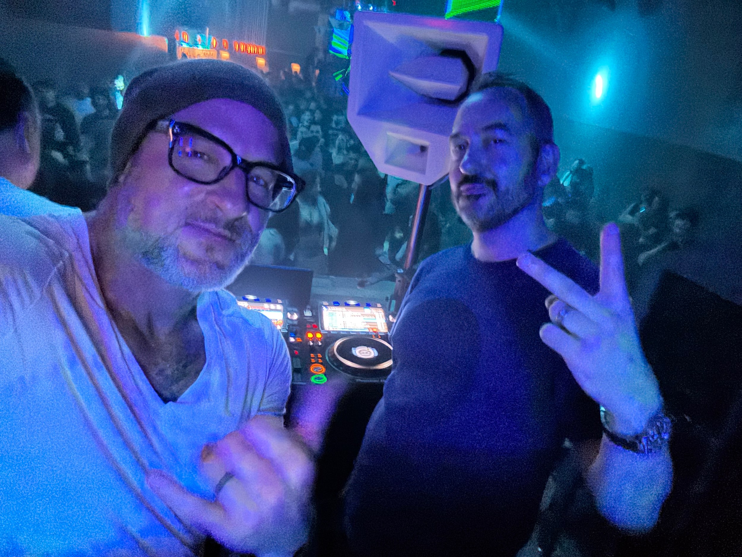 Two Seattle House Mafia DJs in the booth under blue stage lighting at Q Nightclub